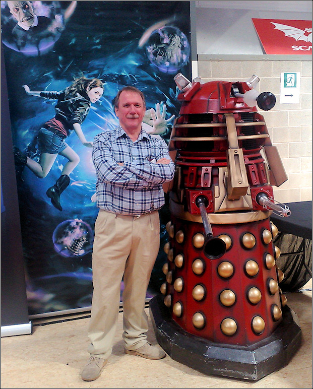 Chairman of Llanelli Community Heritage (John Hopkins) with a Dalek. The Dalek is on the right Chairman of Llanelli Community Heritage (John Hopkins) with a Dalek. The Dalek is on the right